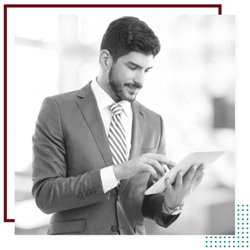 a person in a suit and tie holding a tablet